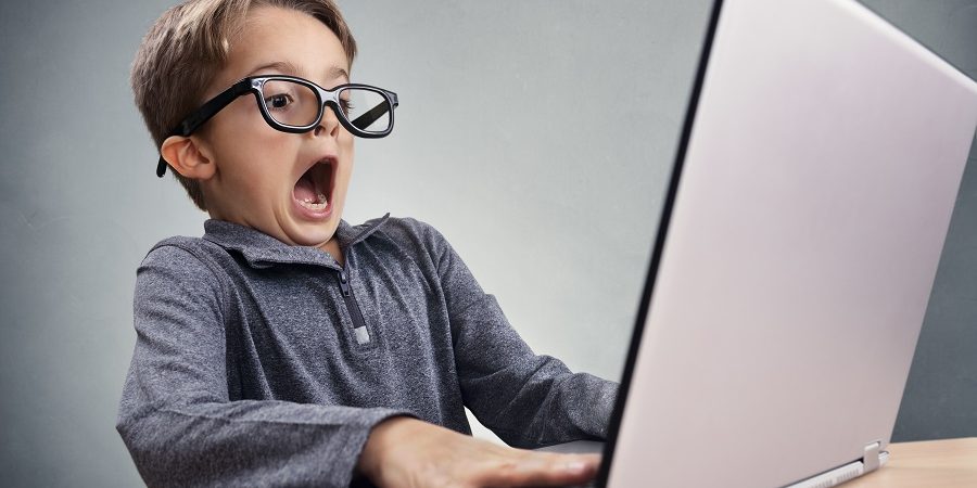 Shocked and surprised boy on the internet with laptop computer c labor management mistakes