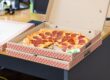 delivery pizza sitting in box at office